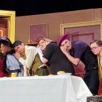 This weekend, the Hoquiam Drama Club is staging Clue, the play based upon movie Clue that is in turn based upon the Hasbro boardgame. In Act 1 in the dining room, Miss Scarlet (Spider Fleury), Mrs. Peacock (Sophie King), Mr. Green (Winston Nesperoz), Mrs. White (Keira Kountz) Professor Plum (Sawyer Getchman) and Colonel Mustard (Zacharie Elliott) eavesdrop on a conversation Wadsworth (Sunny Leonard) is having in another room to learn why they were brought to the Boddy mansion.
Andrea Watts / The Daily World