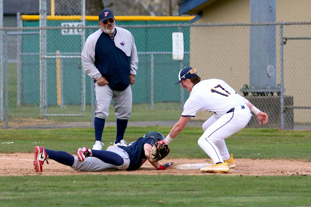 RYAN SPARKS | THE DAILY WORLD Aberdeen first baseman Mylan Bruner (17) applies a tag to Black Hills Brody Lavery during the Bobcats 10-0 win on Friday in Aberdeen.