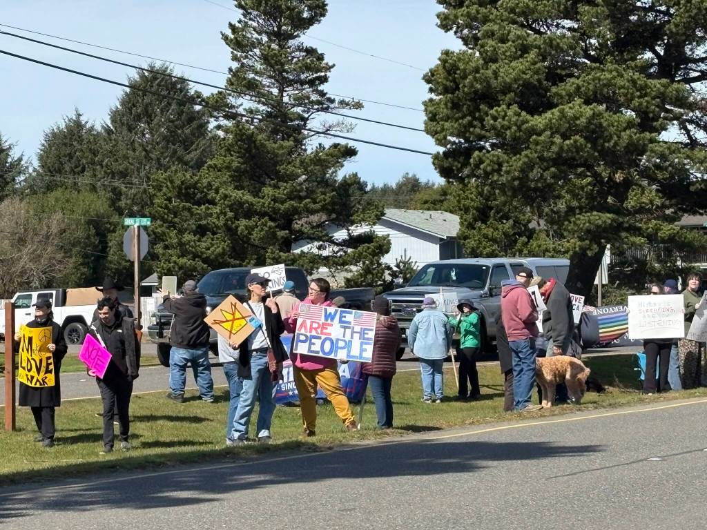 Jerry Knaak / The Daily World
Protesters line up in the median on Point Brown Avenue in Ocean Shores.