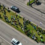 Rallygoers occupy the median on Point Brown Avenue in Ocean Shores during Saturday's "No Kings" protest. (CJ Ripley)
