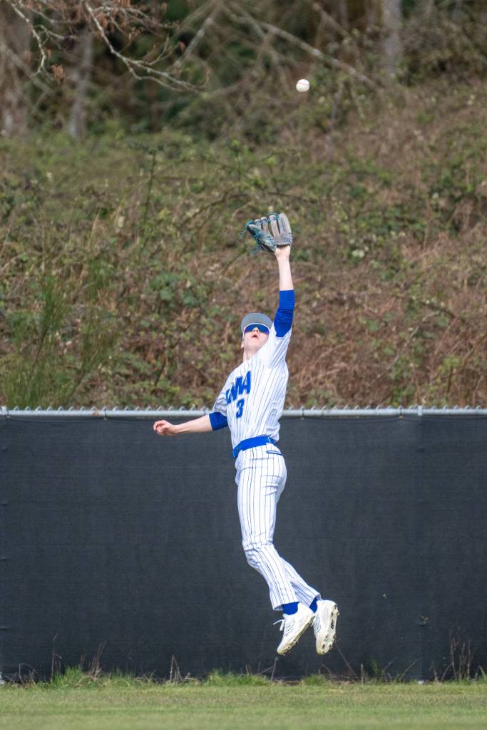 PHOTO BY FOREST WORGUM Elma outfielder Isaac McGaffey makes a leaping catch during a doubleheader against Montesano on Tuesday in Elma.