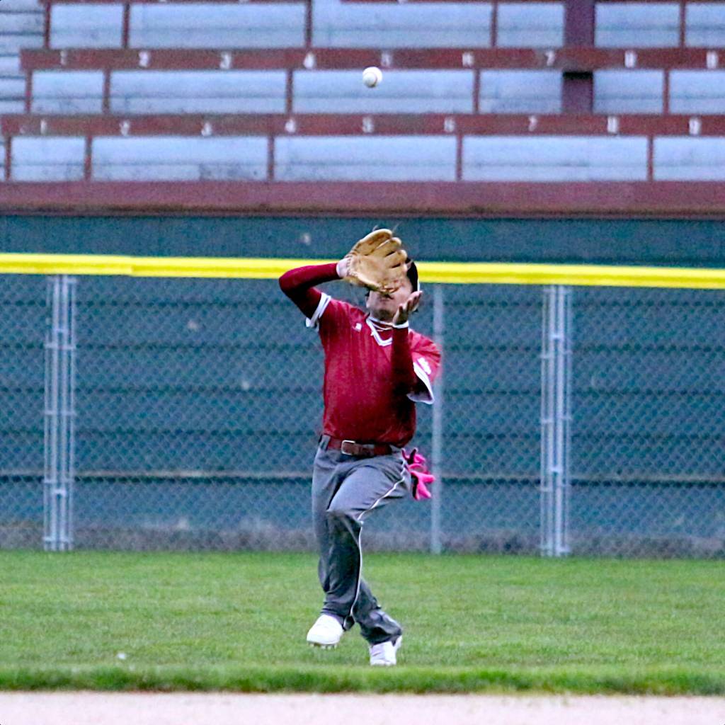 RYAN SPARKS | THE DAILY WORLD Hoquiam outfielder Moses DeShazer makes a catch during the second game of a doubleheader against Rochester on Tuesday at Olympic Stadium in Hoquiam.