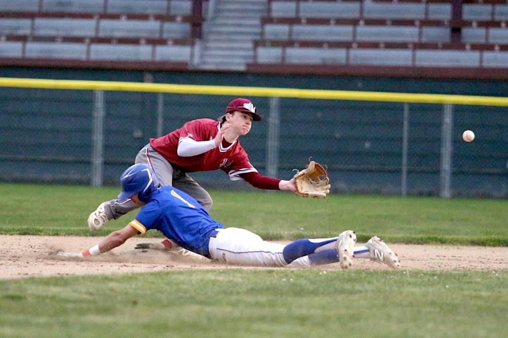 RYAN SPARKS / THE DAILY WORLD Hoquiams Aden Hartt (top) receives a throw as Rochesters Tyler Huston steals second during the second game of a doubleheader against Rochester on Tuesday at Olympic Stadium in Hoquiam.