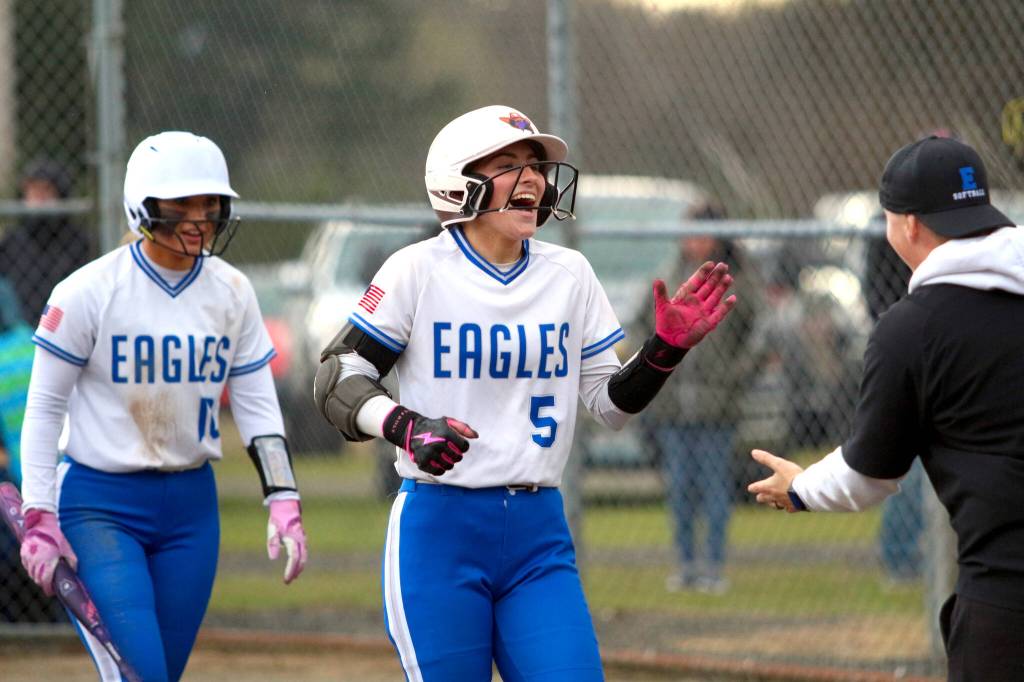 RYAN SPARKS | THE DAILY WORLD Elmas Raelynn Weld (5) is congratulated after scoring the go-ahead run in the sixth inning of a 7-5 loss to Shelton on Thursday in Elma.