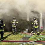 Firefighters head into the intense structure fire in Aberdeen Thursday.