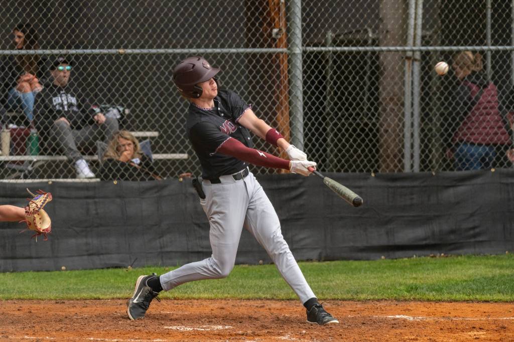 PHOTO BY FOREST WORGUM Montesanos Mason Fry belts one of his two doubles during a 13-1 win over Kings Way Christian on Saturday in Montesano.