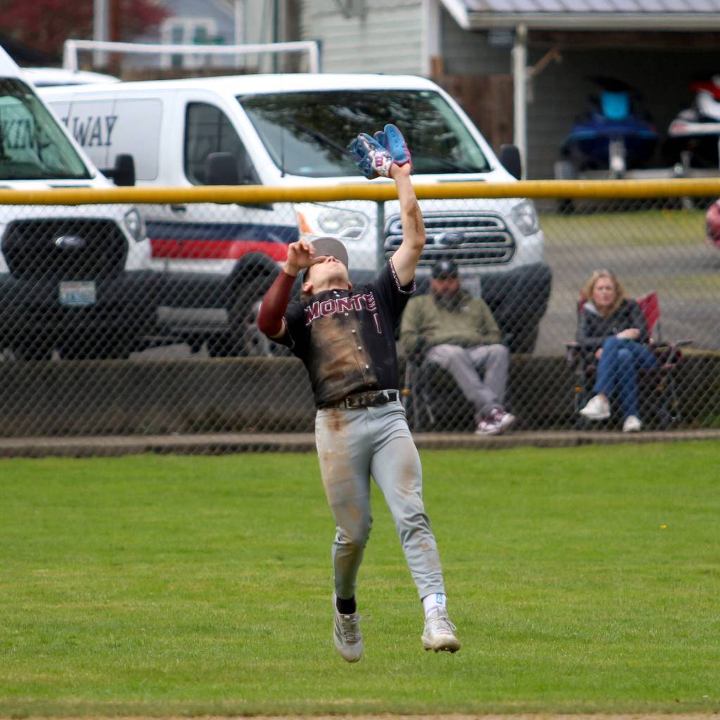 RYAN SPARKS | THE DAILY WORLD Montesanos Kolson Hendrickson ranges back to the outfield grass to make a catch during a 13-1 win over Kings Way Christian on Saturday in Montesano.