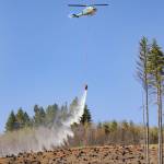 Ridley Hudson photos / The Chronicle
A Department of Natural Resources (DNR) helicopter drops water during the DNR aviation exercise in the Capitol State Forest in April of 2024.