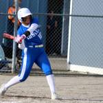 RYAN SPARKS | THE DAILY WORLD Elmas Lynsee Bednarik collects a hit during a 10-0 win over Hoquiam on Monday at Elmas Legacy Ballfields. Bednarik was one of four Eagles with two-hit games in the win.