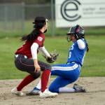 RYAN SPARKS | THE DAILY WORLD Elmas Caroline Cole (right) is tagged out by Hoquiam shortstop Lexi LaBounty on an attempted steal during the Eagles 10-0 win on Monday in Elma.