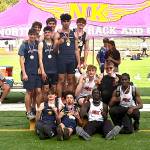 PHOTO COURTESY OF DENISE ROBERTS The Aberdeen 4x400 relay team of Cordell Roberts (top middle, from left), Treven Clarkston (top middle, right), Toby Nelson (sitting), Isaac Garcia (sitting) won the boys elite race at the Dave Snyders Lil Norway Track & Field Invitational on Saturday at North Kitsap High School.