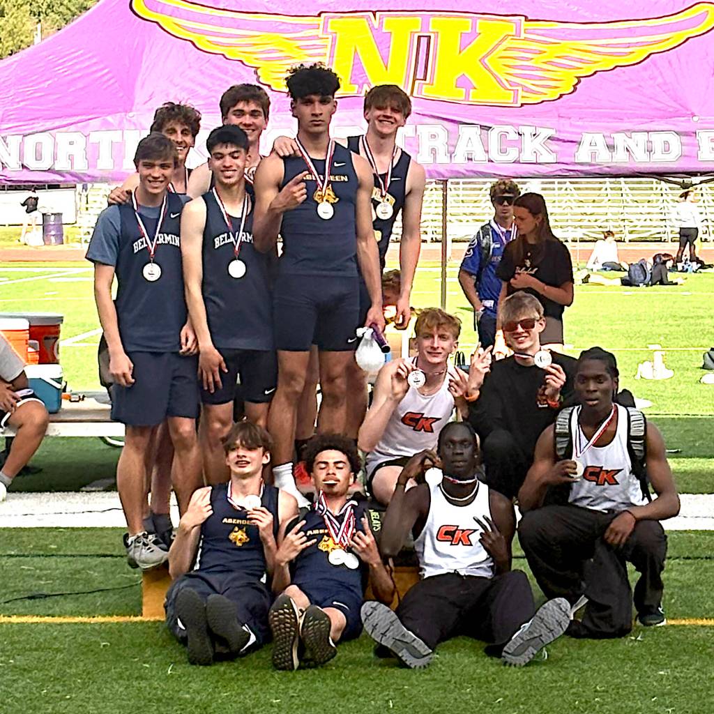 PHOTO COURTESY OF DENISE ROBERTS The Aberdeen 4x400 relay team of Cordell Roberts (top middle, from left), Treven Clarkston (top middle, right), Toby Nelson (sitting), Isaac Garcia (sitting) won the boys elite race at the Dave Snyders Lil Norway Track & Field Invitational on Saturday at North Kitsap High School.