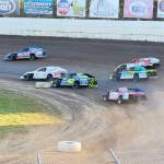 The Daily World
IMCA Modified cars attack turn one at the Grays Harbor Raceway with Grey Ferrando #13 in the lead.