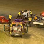 The Daily World
Emergency crews race to aid #92 Steve Hyson after a rollover in turn one of the PHRA Dwarf Car final Saturday night in Elma. Hyson was not injured in the accident, but did not finish the race.