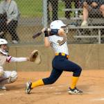 RYAN SPARKS | THE DAILY WORLD Aberdeens Audree Gaddis (right) belts a three-run triple during an 11-0 win over Black Hills on Monday at the Bishop Athletic Complex in Aberdeen.