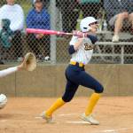 RYAN SPARKS | THE DAILY WORLD Aberdeens Britten Neal (right) smacks a base hit during an 11-0 win over Black Hills on Monday at the Bishop Athletic Complex in Aberdeen.