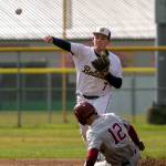PHOTO BY FOREST WORGUM Aberdeen infielder Greg Edwards attempts to turn a double play as W.F. Wests Wyatt Hoffman slides into second base during the Bobcats 2-1 loss on Wednesday at Pioneer Park in Aberdeen.