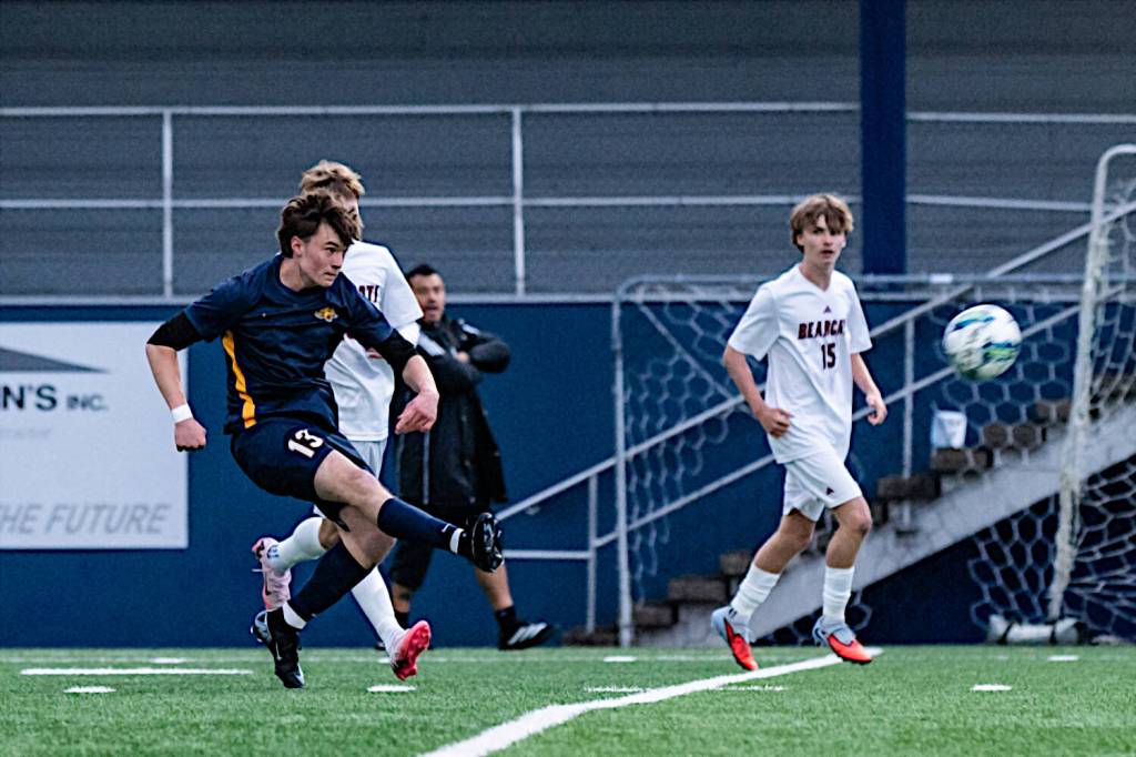 ALICIA TISDALE PHOTOGRAPHY Aberdeens Yoanis Chignesse (left) rips a shot during a 2-0 loss to W.F. West on Tuesday at Stewart Field in Aberdeen.