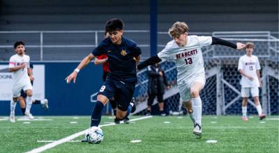 ALICIA TISDALE PHOTOGRAPHY Aberdeens Gibran Garcia (left) is defended by W.F. Wests Carson Newman during the Bobcats 2-0 loss on Tuesday at Stewart Field in Aberdeen.