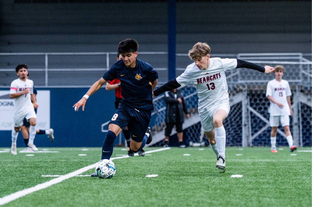 ALICIA TISDALE PHOTOGRAPHY Aberdeens Gibran Garcia (left) is defended by W.F. Wests Carson Newman during the Bobcats 2-0 loss on Tuesday at Stewart Field in Aberdeen.