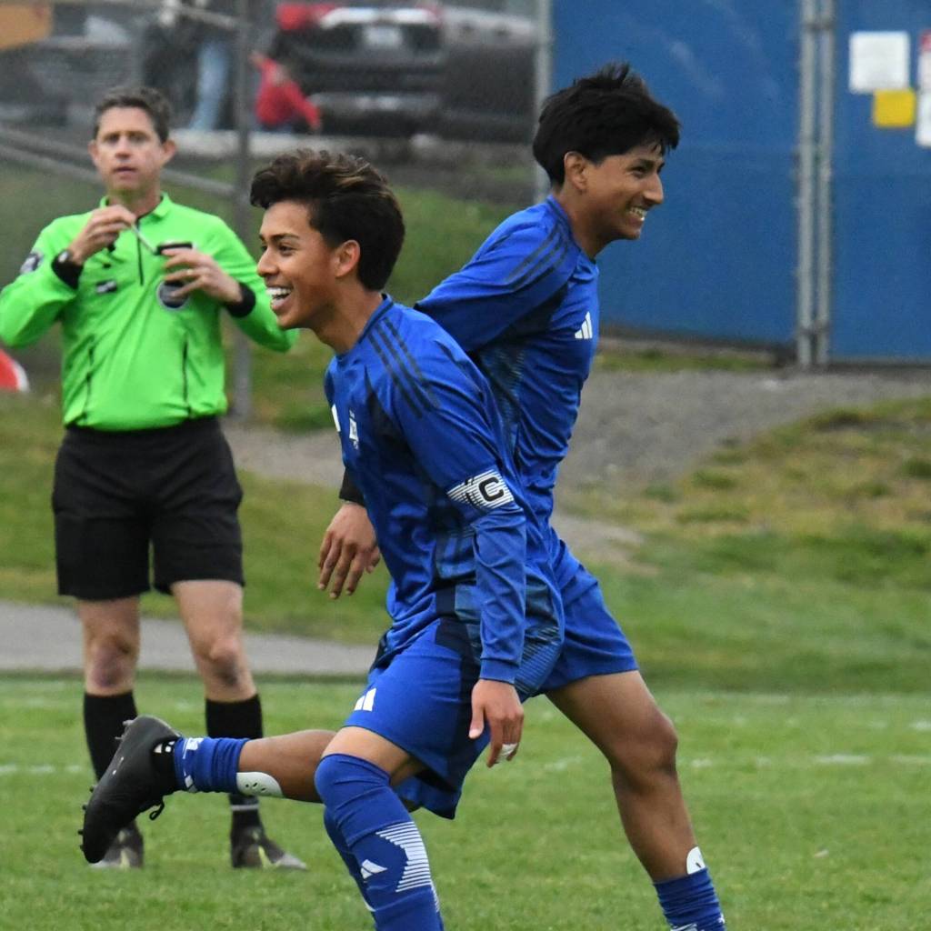 PHOTO BY CINDY MILES Elmas Ivan Rodriguez (left) and Manny Venegas celebrate a goal during a 3-1 win over Montesano on Wednesday at Elma High School.