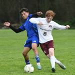 PHOTO BY CINDY MILES Elmas Luis Torres (left) and Montesanos Brady Whipple compete for possession during the Eagles 3-1 win on Wednesday in Elma.