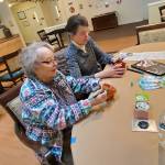 At Riverside Place Memory Care, residents and family members celebrated Earth Day by planting vegetable and flower seeds. Andrea Watts / The Daily World