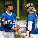 RYAN SPARKS | THE DAILY WORLD Elma pitcher Ashlynn Weld (left) and third baseman Lynsee Bednarik give each other five during a 10-6 loss to Montesano on Thursday at Montesano High School.