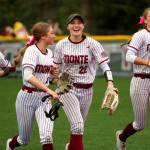 RYAN SPARKS | THE DAILY WORLD Montesano center fielder Taylor Galvin (22) is surrounded by teammates (from left) Jaelyn Butterfield, Lainey Robinson and Lex Stanfield after making a diving catch in the fourth inning of a 10-6 win over Elma on Thursday in Montesano.