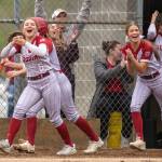PHOTO BY FOREST WORGUM Hoquiams Kacee Kruger (left) and Avery Brodhead celebrate during the Grizzlies 8-1 win over Rochester on Thursday at John Gable Park in Hoquiam.