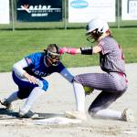 NICOLE SHANNON | MAIN FOCUS MEDIA Montesanos Taylor Galvin (right) slides into third against Elmas Lynsee Bednarik during the Bulldogs 5-0 victory on Friday in Elma.