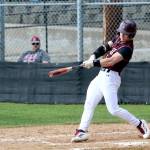 RYAN SPARKS | THE DAILY WORLD Montesanos Zach Timmons belts a three-run home run during a 5-3 victory over Hoquiam on Friday at Vessey Field in Montesano.