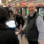 Michael Wagar / The Daily World
Lewis Bumstead, Operations Manager for Swansons, is all smiles while helping customers at the South Aberdeen store.