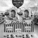 Mark Swanson / Jones Photo Collection
This image shows multiple contest posters around a supermarket display of Sweethearts Soap, which is the contest sponsor. From the top: a balloon-shaped sign has colored lettering on a dark background, pleading Enter Sweethearts Dream Come True Contest, Win a $30,000 Home and Car. This display was evidently at Swansons, probably the Hoquiam store but possibly in Aberdeen. Below that sign are placed two large posters of identical infants appreciatively staring at bars of soap in their hands. Below the twins are stacked an estimated 1,900 boxes of soap. Lastly, more posters wrap the bottom of the display, showing a family of five contemplating a ranch-style home with a station wagon parked in the garage. The automobile pictured resembles a circa 1954 General Motors product.