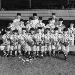 The Polson Museum
The image is a team photograph of the 1964 Swansons Little League baseball team.