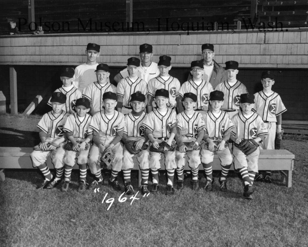 The Polson Museum
The image is a team photograph of the 1964 Swansons Little League baseball team.