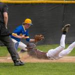 PHOTO BY FOREST WORGUM Montesanos Carter Ames (right) slides in with a triple during a win over Rochester in a doubleheader on Tuesday in Montesano.