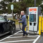Jerry Knaak / The Daily World
Clean & Prosperous Institute Executive Director Michael Mann demonstrates the new EVCS charging station at the Ocean Shores Public Library.
