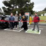 Jerry Knaak / The Daily World
Ocean Shores Public Library Director Keitha Owen cuts the ribbon officially opening the new EVCS charging station.