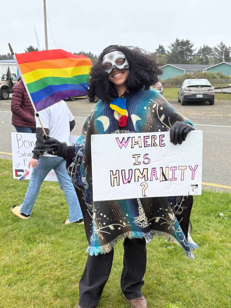 Jerry Knaak / The Daily World
A May Day rallygoer in Ocean Shores poses for a photo.