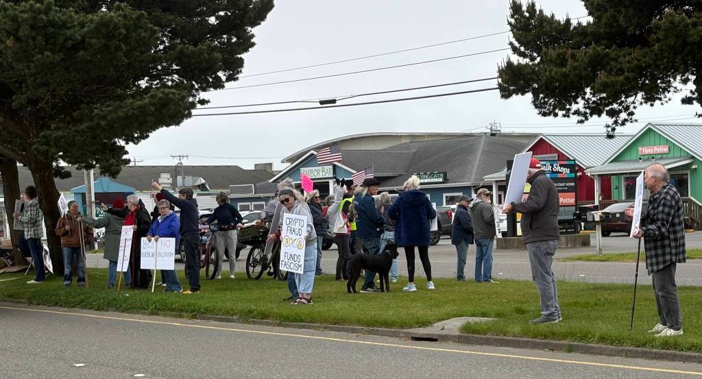 Jerry Knaak / The Daily World
May Day rally attendees line the median on Pt. Brown Ave. in Ocean Shores.