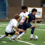 RYAN SPARKS | THE DAILY WORLD Aberdeens Edward Ceja (right) splits the Tumwater defense in a 2-1 win (5-4 on penalty kicks) over Tumwater on Friday in Aberdeen.