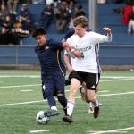 RYAN SPARKS | THE DAILY WORLD Aberdeen midfielder Gibran Garcia (left) retains possession against Tumwaters Thomas Williams during the Bobcats 2-1 win (5-4 on penalty kicks) on Friday in Aberdeen.