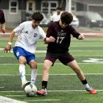 PHOTO BY CINDY MILES Elmas Bryan Torres (8) is defended by Raymond-South Bends Jayden Silva during a 3-3 tie on Wednesday in South Bend.