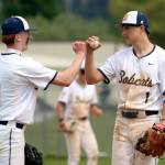 RYAN SPARKS | THE DAILY WORLD Aberdeens Gabe Matthews (9) give a fist bump to pitcher Bubba Jones during a 5-1 win over Woodland in a 2A District 4 play-in game on Friday at Pioneer Park in Aberdeen.