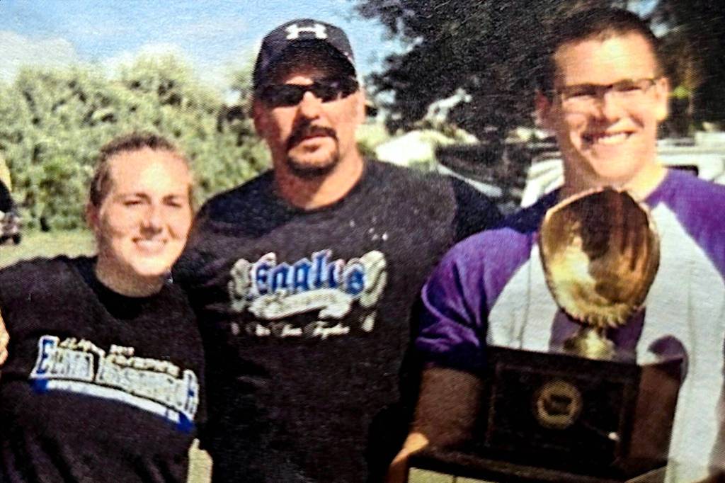 RYAN SPARKS | THE DAILY WORLD Mitchell Todd (middle) poses for a photo after helping Elma win the 1A State Softball Championship in 2014. Todd passed away in a vehicle accident on May 3.