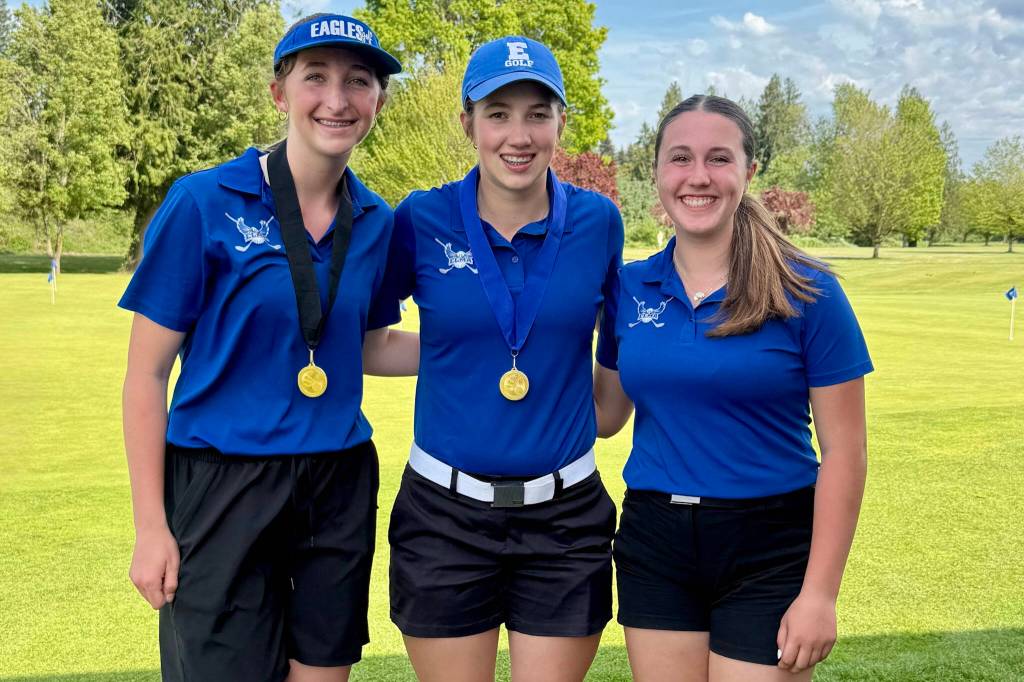 SUBMITTED PHOTO Elmas Mercedes Carter (left), Olivia Moore and Kyla Rudy (right) pose for a photo at the conclusion of the 1A District 4 Championships on Monday at the Tumwater Valley Golf Course.