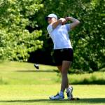 PHOTO BY HAILEY BLANCAS Elma senior Olivia Moore shoots from the fairway during the 1A District 4 Championships on Monday at the Tumwater Valley Golf Course. Moore won her third district golf championship with a total of 165 for the two-day meet.
