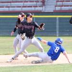 RYAN SPARKS | THE DAILY WORLD Montesano shortstop Toren Crites (2) attempts to turn a double play against La Centers Brady Brandenburg during the Bulldogs 10-0 win in a 1A District 4 quarterfinal game on Tuesday in Hoquiam.