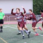 RYAN SPARKS | THE DAILY WORLD Montesanos Daniel Schallon (12) celebrates with his teammates after scoring a goal in 3-2 loss to La Center a 1A District 4 Tournament elimination game on Thursday at Montesano High School.